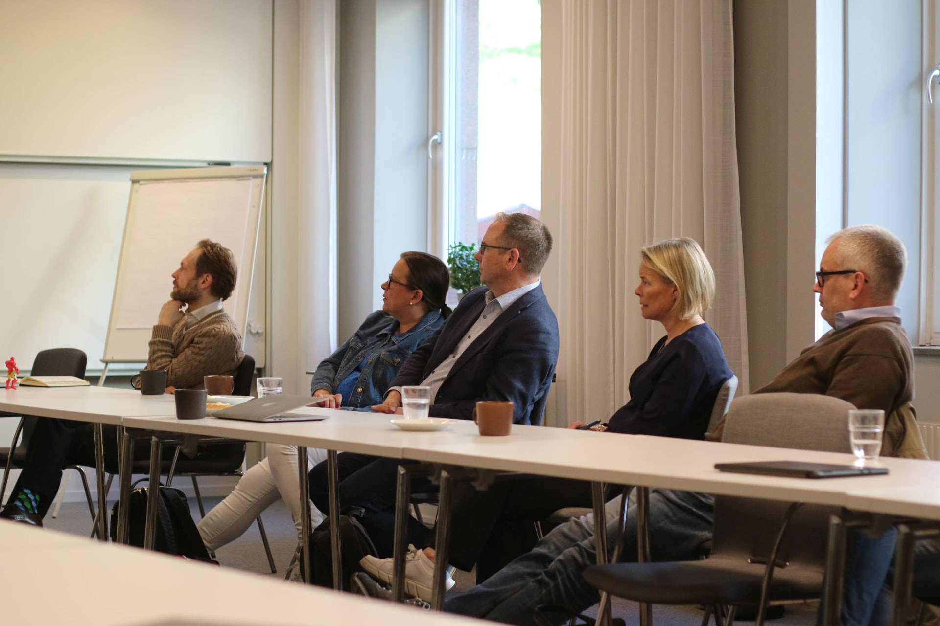 Healthtech workshop participants working together in the Stockholm meeting room